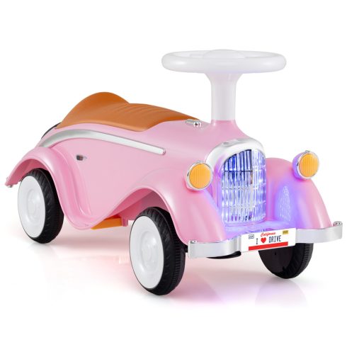 Kisgyermek lovaglás a Toy Classic tolóautón, kürttel és rózsaszín LED-es fényszóróval