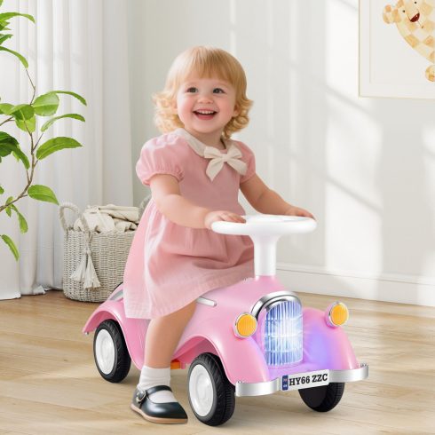 Kisgyermek lovaglás a Toy Classic tolóautón, kürttel és rózsaszín LED-es fényszóróval